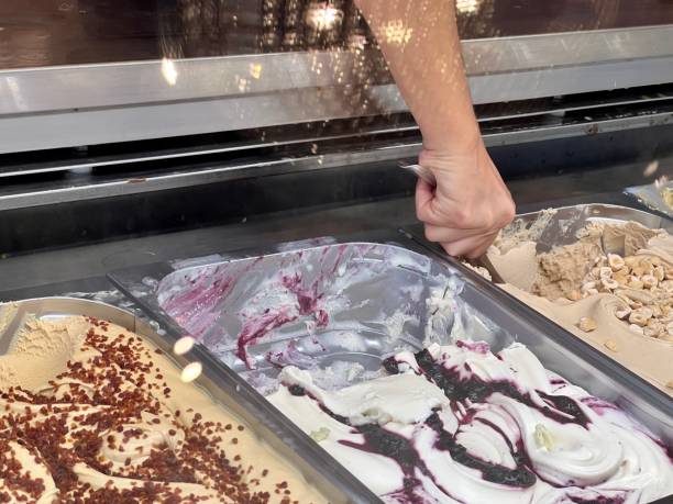 istock hand of an ice cream maker putting an ice cream 1674626842