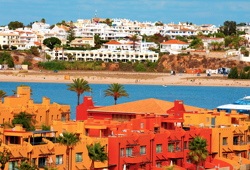 Portimao,Portiman,Algarve,Portugal. 27.09.2020 view village of ferragudo from torona portimao, river embankment. vivid houses, blue wather and sky. Europe travel and holiday concept