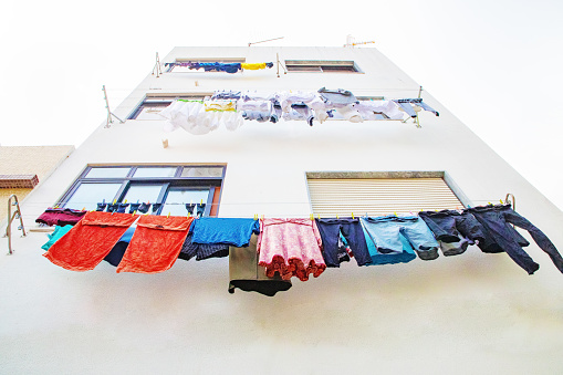 Portimao,Portiman,Algarve,Portugal. 27.09.2020 Washed Fresh clean clothes drying outside. hanging on line. Laundry on rope. outside of old house. Traditional Potugal