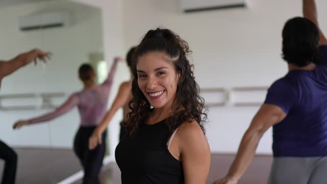 Portrait of a mid adult woman in dancing class at the dance studio