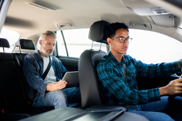 istock Young taxi driver having a male customer 1674655882