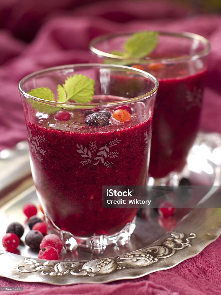 Berry smoothie Berry smoothie with red and black currant, cranberry, cow berry, strawberry, selective focus Berry Fruit Stock Photo