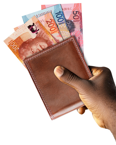 Black Hand Holding brown wallet With South African Rand notes.