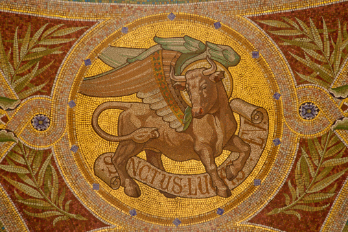 Madrid - Mosaic of bull as symbol of Saint Luke the Evangelist in Iglesia de San Manuel y San Benito by architect Fernando Arbos from 19. cent. in March 9, 2013 in Madrid.