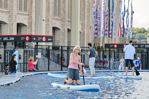 People on stand up paddle board in the city center - Moscow, Russia, 05 September 2023