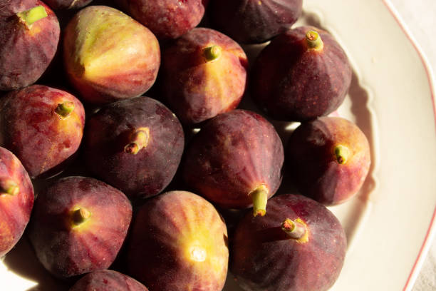 istock Ripe figs on the plate. Flat lay. Close up. 1674714382