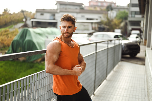 portrait of a muscular man outdoors.