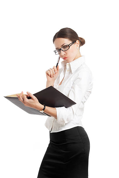 istock young woman holding notepad with glasses 167481486