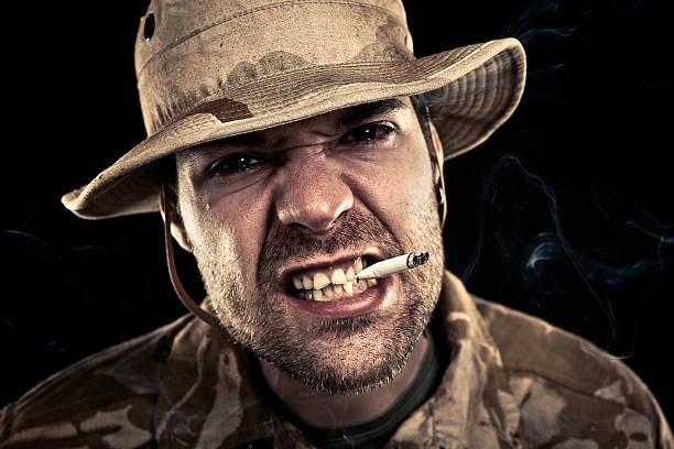 istock Military Soldier Smoking A Cigarette While Sneering 167481643