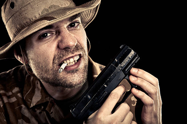 istock Military Soldier Smoking Cigarette And Holding A Gun 167481686