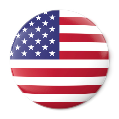 A pin button with the flag of the United States of America. Isolated on white background with clipping path.