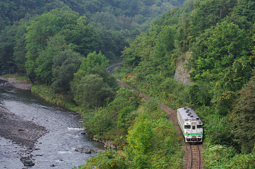 Engaru-cho, Hokkaido, Japan - September 11, 2023 : KIHA 40 Local train running on S-shaped curve