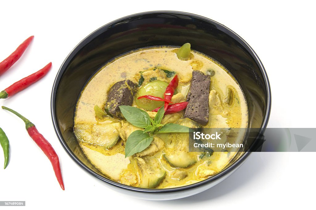 thai Green Curry with Chicken in a black bowl Thai Green Curry with Chicken in a black bowl Chicken Curry Stock Photo
