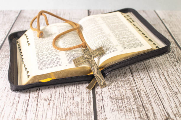 istock Ukraine, Kyiv - February 25, 2019: Composition of religious themes. Table Bible 1674898906