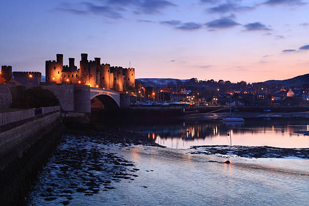 A picture of Conway Castle at dusk Conwy castle at dusk in north Wales UK conwy castle stock pictures, royalty-free photos & images