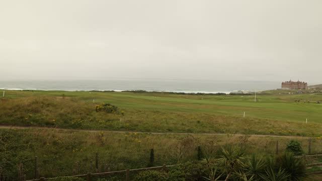 Timelapse shot of golfers playing at Newquay Golf Club with the Headlands Hotel
