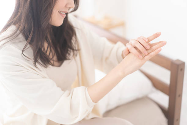 istock An Asian woman is applying hand cream on her hands. 1674934455