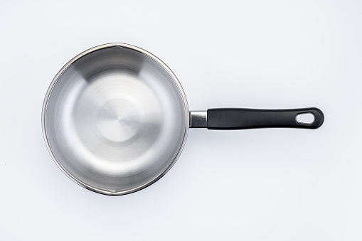Stainless steel cooking pot isolated over white background.