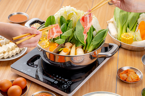 enjoy eating Shabu Shabu and Sukiyaki in hot pot at japanese \nrestaurant