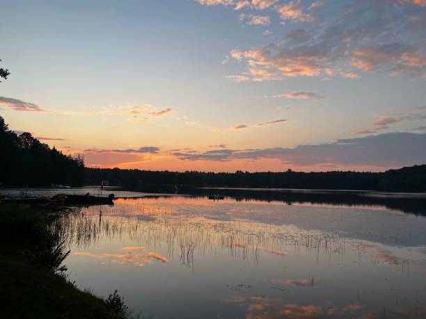 istock Sunset at cottage lake 1674950181