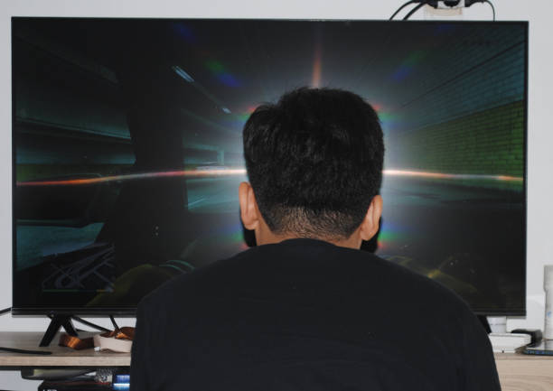 istock Boy is playing a game in the TV screen. 1675029858