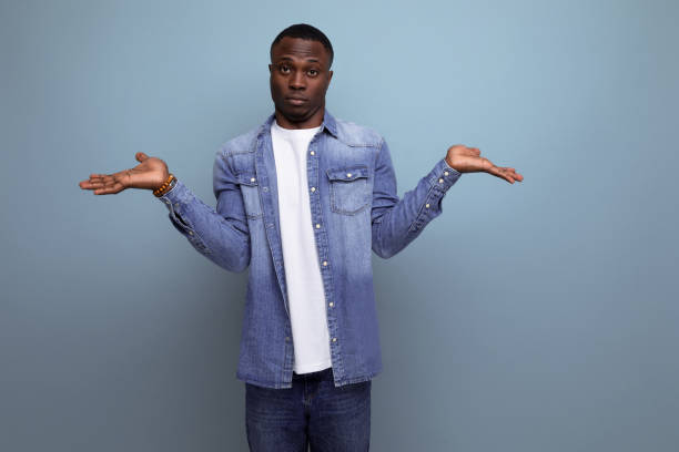 istock young doubtful handsome african guy in spring urban clothes on isolated background with copy space 1675032474