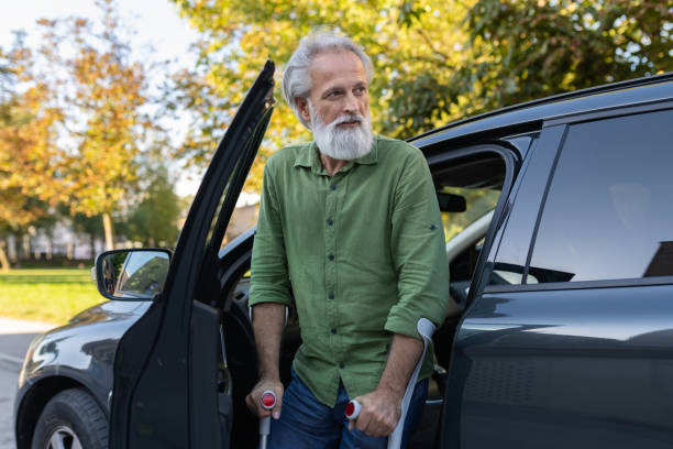 istock An elderly man with a disability and on crutches 1675055475