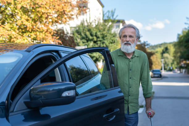 istock An elderly man with a disability and on crutches 1675055483