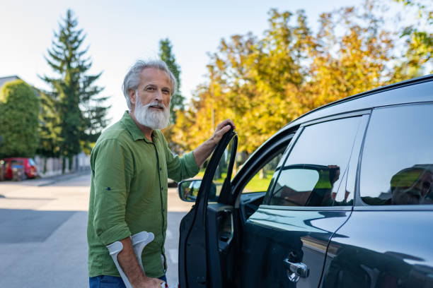istock An elderly man with a disability and on crutches 1675055489
