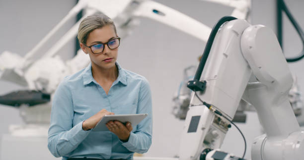 istock Engineer, woman with tablet and programming in robotics factory, high tech and innovation in industry. Automation, electronics and inspection of robot for engineering, software and machine learning 1675096651