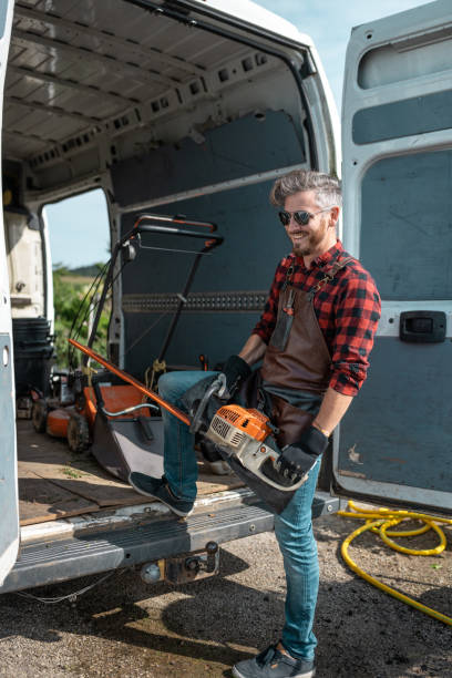 istock A gardener equips a work van delivery vehicle. 1675121581