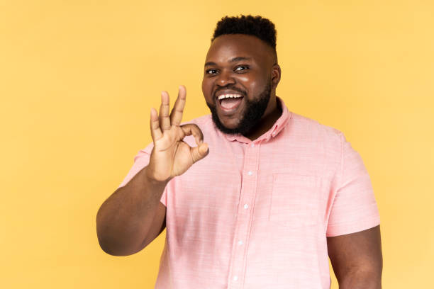istock Man doing okay gesture and smiling with joyous satisfied contented expression. 1675153899