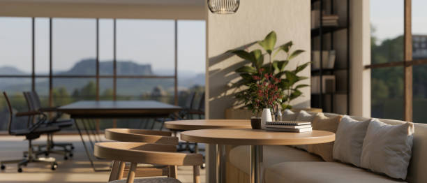 istock A wooden table in a modern and comfortable co-working space or office relaxation area. 1675158881