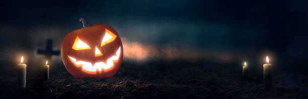 istock Pumpkin Jack O 'Lantern with spooky glowing eyes on Halloween night 1675220184