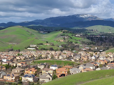 The foothills of the Diablo range turn green with winter rains while the summit of Mt Diablo receives snow every winter