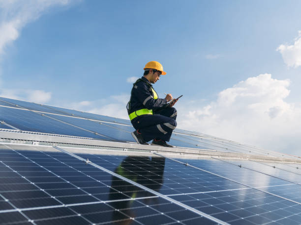 istock Service engineer checking solar cell on the roof for maintenance if there is a damaged part. Engineer worker install solar panel. Clean energy concept. 1675291281