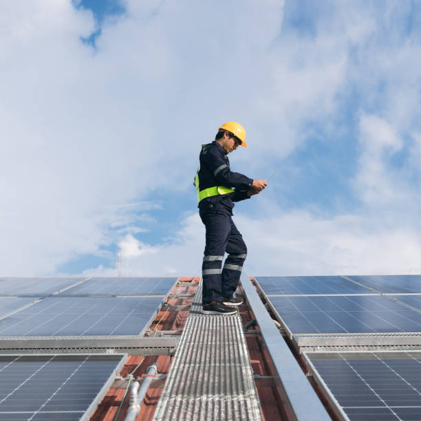 istock Service engineer checking solar cell on the roof for maintenance if there is a damaged part. Engineer worker install solar panel. Clean energy concept. 1675297762