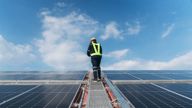 istock Service engineer checking solar cell on the roof for maintenance if there is a damaged part. Engineer worker install solar panel. Clean energy concept. 1675299318