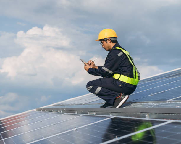 istock Service engineer checking solar cell on the roof for maintenance if there is a damaged part. Engineer worker install solar panel. Clean energy concept. 1675299868