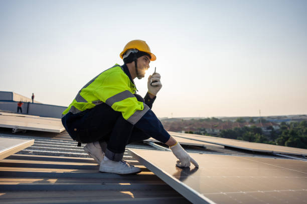 istock Professional engineer work to maintenance of photovoltaic panel system. Attractive technician worker working on roof inspect and check solar cell panels equipment box at solar cell field during sunset 1675306510