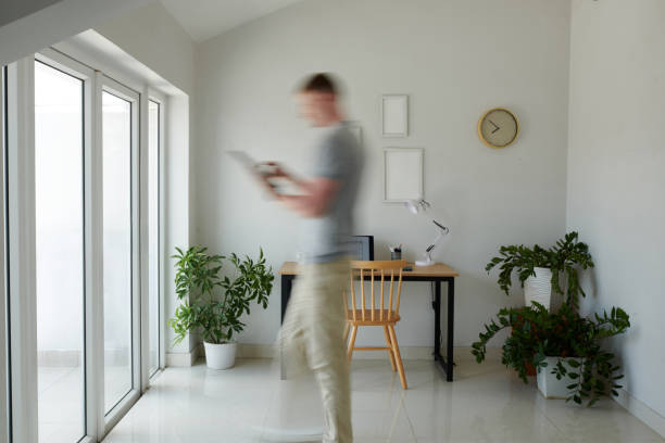 istock Businessman Walking to Apartment Window 1675307819