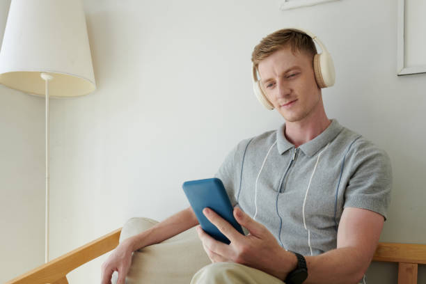 istock Man Listening to Music from Playlist 1675307862