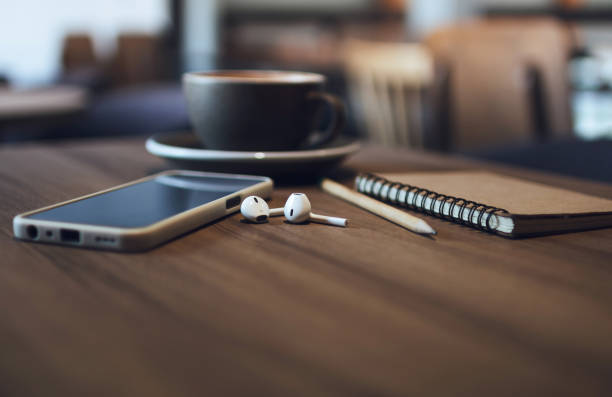 istock coffee drink with mobile relaxing in cafe 1675309609