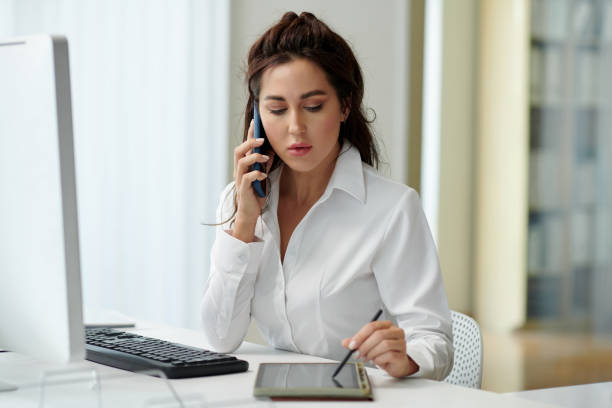 istock Businessman Talking on Phone with Colleague 1675310347