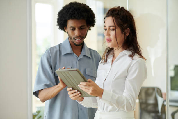 istock Business People Discussing Report 1675310402