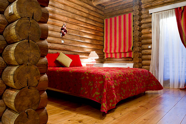 ログキャビンベッドルーム - cabin indoors rustic bedroom ストックフォトと画像