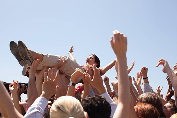 Woman crowd surfing  mosh pit stock pictures, royalty-free photos & images