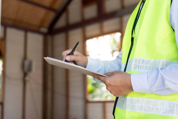 istock inspector or engineer is inspecting construction and quality assurance new house using a checklist. Engineers or architects or contactor work to build the house before handing it over to the homeowner 1675338075