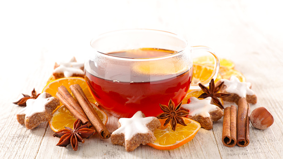 Hot tea drink with spicy ginger cookies- winter drink, christmas tea concept