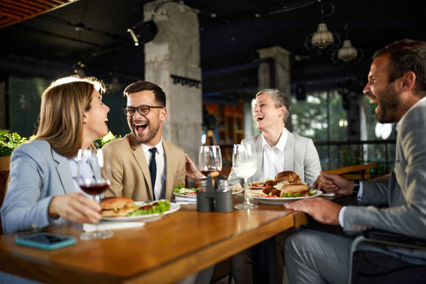 istock Cheerful entrepreneurs talking on a lunch in a restaurant. 1675366598